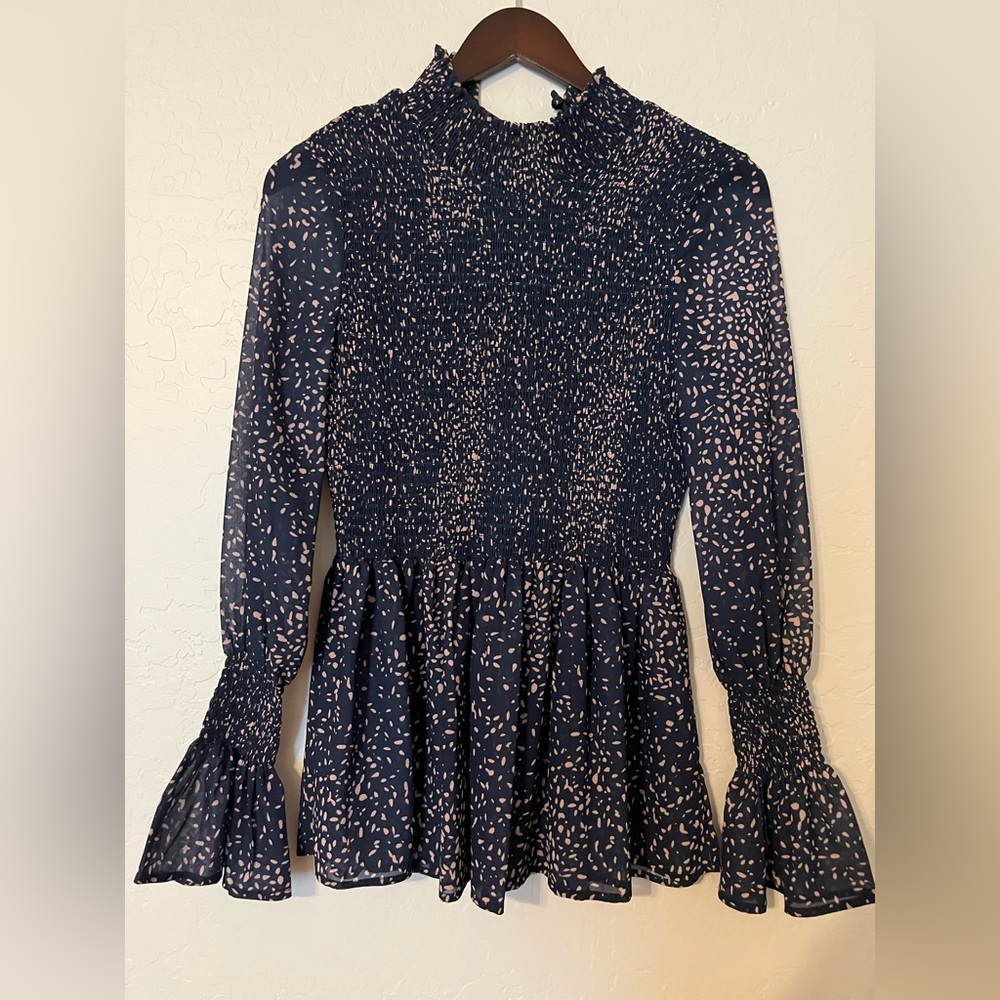 NEW! Navy smocked peplum with mock neck